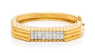 An 18 Karat Yellow Gold, Platinum and Diamond Bangle Bracelet, 34.00 dwts.