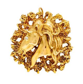 * A 14 Karat Yellow Gold and Diamond Horse Head Pendant/Brooch, La Triomphe, 24.50 dwts.