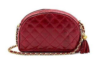 * A Chanel Red Quilted Lizardskin Bag, 9 x 5 x 2 inches.