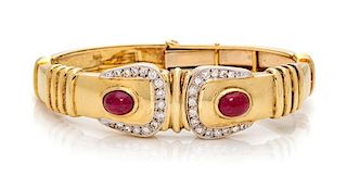 A 14 Karat Bicolor Gold, Ruby and Diamond Buckle Motif Bangle Bracelet, 23.00 dwts.