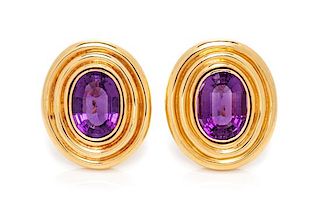 A Pair of 14 Karat Yellow Gold and Amethyst Earclips, 15.30 dwts.