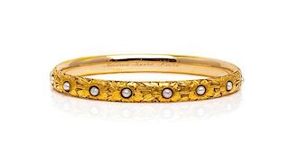 * An Art Nouveau 14 Karat Yellow Gold and Cultured Pearl Bangle Bracelet, Carter, Gough & Co., 8.80 dwts.