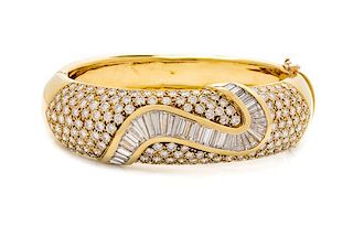 An 18 Karat Yellow Gold and Diamond Bangle Bracelet, 62.00 dwts.