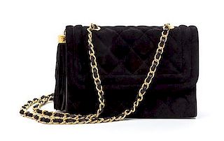 * A Chanel Black Quilted Suede Flap Bag, 8 x 5 1/2 x 2 1/2 inches.