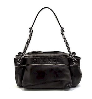 * A Chanel Black Leather Bag, 11 x 5 1/2 x 5 inches.