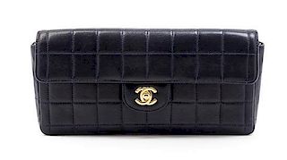 * A Chanel Navy Quilted Leather Convertible Flap Bag, 10 1/2 x 5 x 1 1/2 inches.