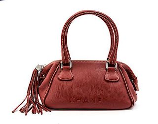 * A Chanel Red Stitched Leather Bag, 13 x 6 x 5 1/2 inches.