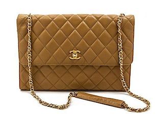 * A Chanel Tan Quilted Leather Flap Bag, 12 x 8 x 2 inches.