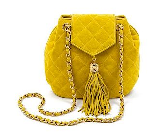 * A Chanel Yellow Quilted Suede Bag, 8 1/2 x 7 x 3 inches.