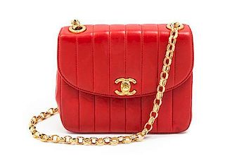 A Chanel Rouge Quilted Leather Flap Bag, 7 x 5 1/2 x 2 3/4 inches.