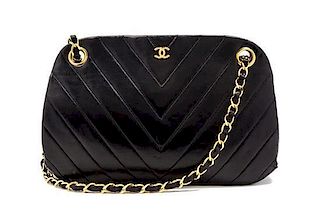 * A Chanel Black Chevron Quilted Leather Bag, 10 x 5 1/2 x 3 inches.