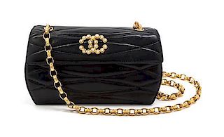 * A Chanel Black Quilted Leather and Faux Pearl Flap Bag, 7 1/2 x 4 1/2 x 2 1/2 inches.