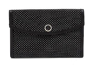 * An Hermes Black and Silver Lame Woven Clutch, 9 1/2 x 6 x 1 inches.