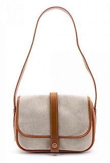 * An Hermes Canvas and Brown Leather Trim Shoulder Bag, 11 x 8 x 3 inches.