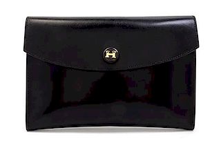 * An Hermes Black Leather Rio Clutch, 9 1/2 x 6 1/2 x 1 inches.