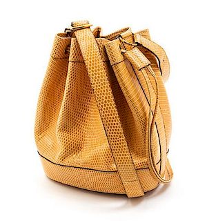 * An Hermes Peach Lizardskin Drawstring Bag, 9 x 7 x 3 inches.