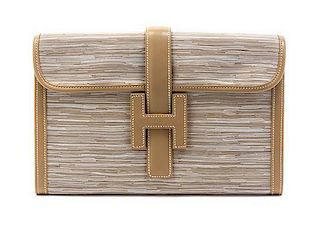 * An Hermes Ivory Vibrato Leather Jige Clutch, 11 1/2 x 7 1/2 x 1 1/2 inches.