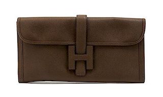 * An Hermes Brown Leather Jige Clutch, 11 x 6 x 1 inches.