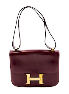* An Hermes 23cm Rouge Leather Constance Bag, 9 x 7 x 2 inches.