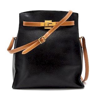 * An Hermes 30cm Black Leather Kelly Sport Bag, 12 x 11 1/2 x 5 inches.