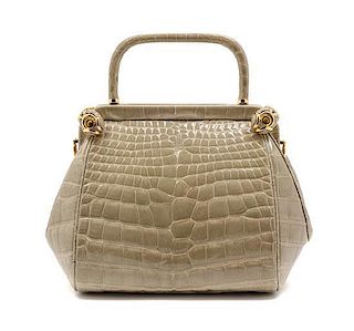 * A Judith Leiber Taupe Alligator Evening Bag, 8 1/2 x 6 x 4 inches.