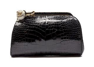 * A Judith Leiber Black Alligator Evening Bag, 8 1/2 x 5 1/2 x 1 1/2 inches.