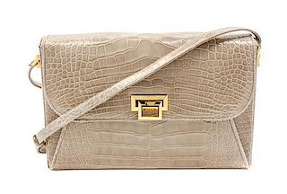 * A Judith Leiber Taupe Alligator Shoulder Bag, 12 x 7 1/2 x 2 inches.