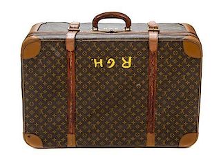 * Two Louis Vuitton Monogram Canvas Soft-sided Suitcases, 31 x 20 1/2 x 10 inches.