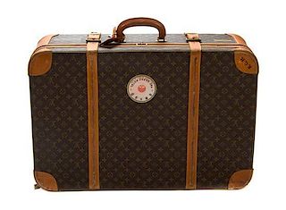 * Two Louis Vuitton Monogram Canvas Soft-sided Suitcases, 31 x 20 x 9 1/2 inches.