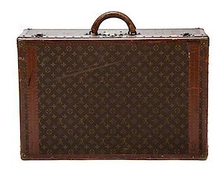 * A Louis Vuitton Monogram Canvas Hard-sided Suitcase, 27 1/2 x 18 x 8 inches.