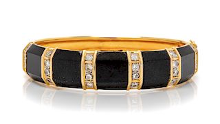 An 18 Karat Yellow Gold, Diamond and Onyx Bangle Bracelet, 35.10 dwts.
