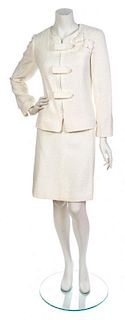 * A Chanel White Cotton Boucle Skirt Suit, Jacket size 44, skirt size 42.