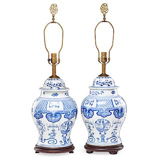 PAIR OF CHINESE BLUE AND WHITE PORCELAIN COVERED URNS