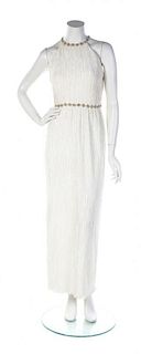 * A Mary McFadden Couture Ivory Pleated Halter Gown, Size 6.