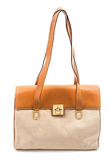 * A Celine Ivory Canvas and Tan Leather Bag, 13 1/2 x 9 x 4 inches.