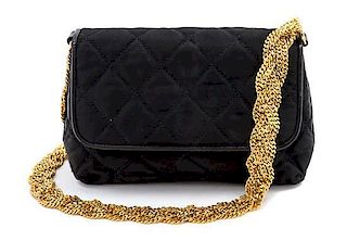 * A Chanel Black Satin Quilted Bag, 7 1/2 x 4 1/2 x 2 1/2 inches.