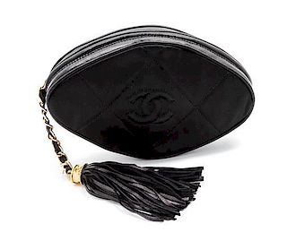 * A Chanel Black Satin Quilted Clutch, 7 1/2 x 4 x 2 inches.