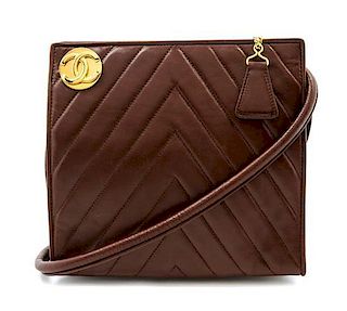 * A Chanel Brown Chevron Quilted Leather Bag, 7 1/2 x 7 x 1 1/2 inches.