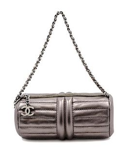 * A Chanel Grey Metallic Quilted Leather Bag, 7 1/2 x 3 x 3 inches.