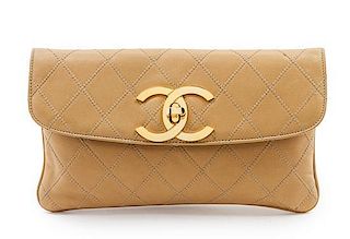 * A Chanel Tan Quilted Leather Flap Clutch, 10 x 5 1/2 x 1 inches.