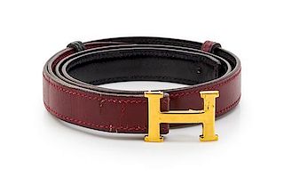 * An Hermes Rouge Leather Mini Constance Belt,