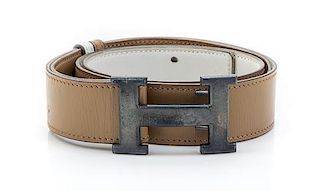 * An Hermes Tan and Ivory Reversible Leather Constance Belt,