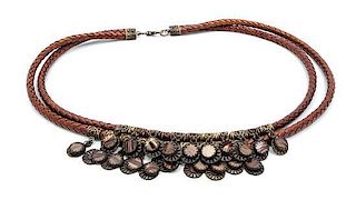 * An Oscar de la Renta Brown Braided Leather Rope Tribal Belt,