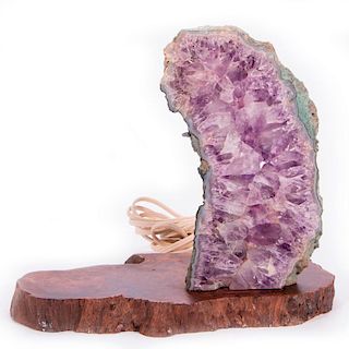 Large Amethyst geode mounted on stand.