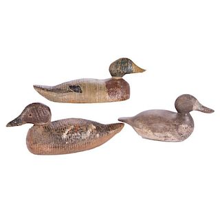 Three carved vintage duck decoys.