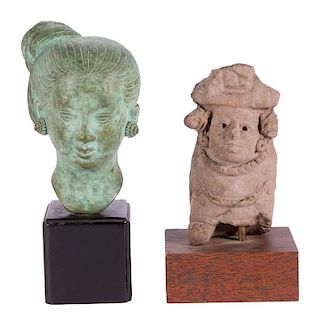 Two busts on stands.