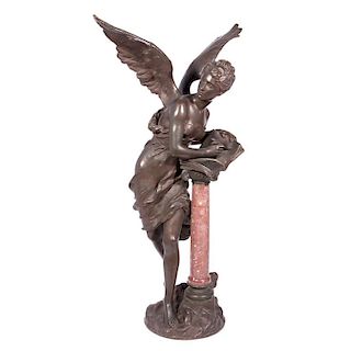 A bronze and marble sculpture of an angel.