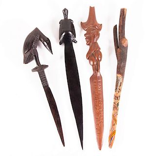 Four carved letter openers.