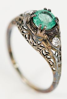 18 karat white gold filigree ring, set with round green stone and flanked by diamond on either side approximately .75 ct., probably...