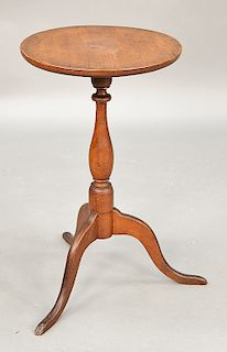Cherry candlestand with round top on slender turned shaft set on high tripod base, in old finish.  ht. 27 3/4 in., top: 16 1/4" x...